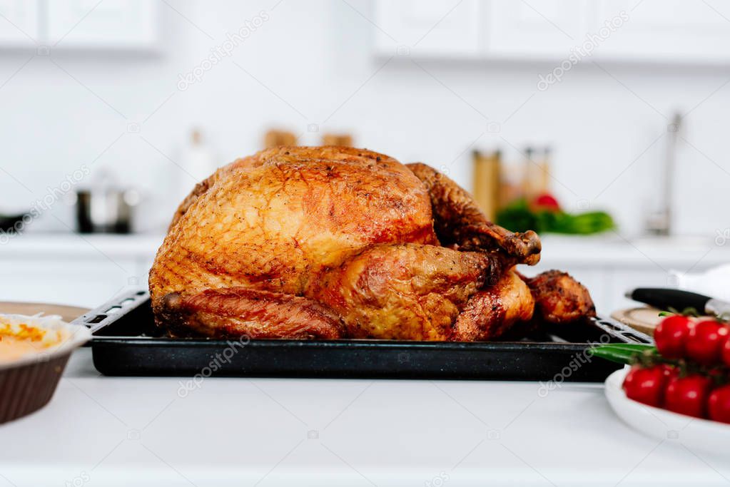 close-up shot of freshly baked turkey on table at kitchen for thanksgiving day