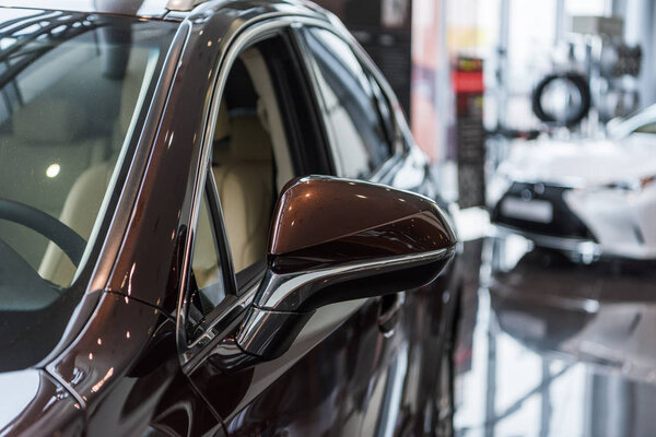 selective focus of luxury cars at dealership salon