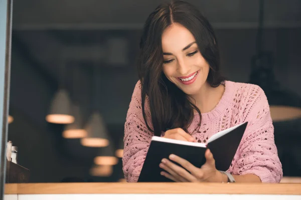 Happy Young Woman Making Notes Textbook Table Cafe — Stock Photo, Image