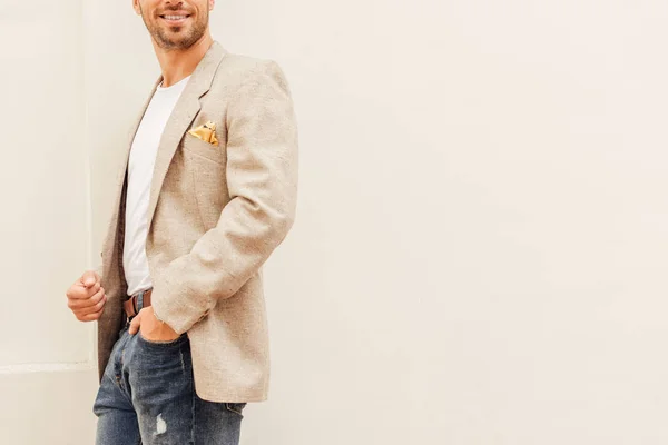 Cropped Image Man Jacket Jeans Standing Beige Wall City — Stock Photo, Image