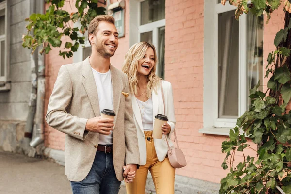 Laughing Couple Autumn Outfit Holding Hands Walking Street Disposable Coffee — Stock Photo, Image