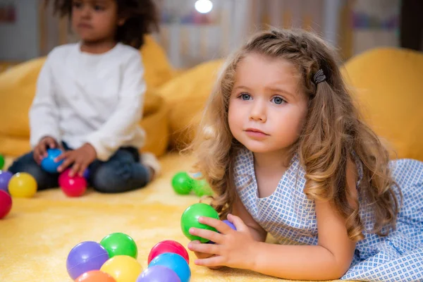 Adorable Multicultural Kids Playing Yellow Carpet Colored Balls Kindergarten — Stock Photo, Image