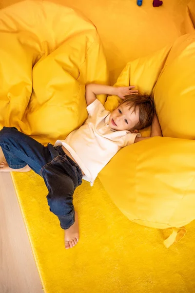 High Angle View Adorable Boy Lying Bean Bag Chair Kindergarten — Stock Photo, Image