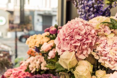 selective focus of beautiful flowers at flower shop clipart