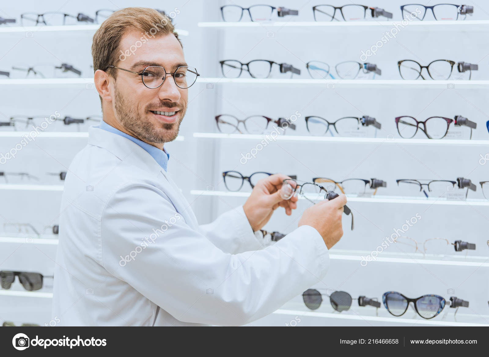 Male Optometrist Taking Glasses Shelves Ophthalmic Shop — Free Stock ...