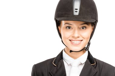 close-up portrait of happy young horsewoman in helmet looking at camera isolated on white clipart