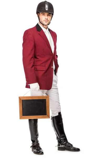 Attractive Young Horseman Uniform Holding Blank Chalkboard Looking Camera Isolated — Free Stock Photo