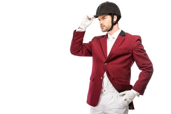 Atractivo Jinete Joven Uniforme Casco Mirando Hacia Otro Lado Aislado — Foto de Stock