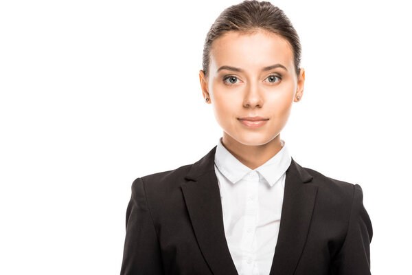 close-up portrait of attractive young businesswoman in suit looking at camera isolated on white