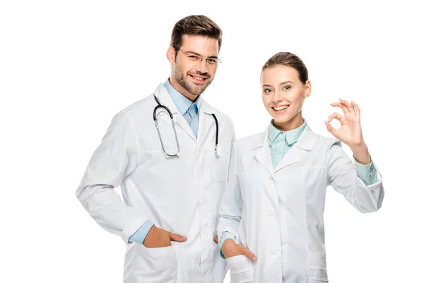 Beautiful Female Doctor Showing Sign While Her Male Colleague Standing — Stock Photo, Image
