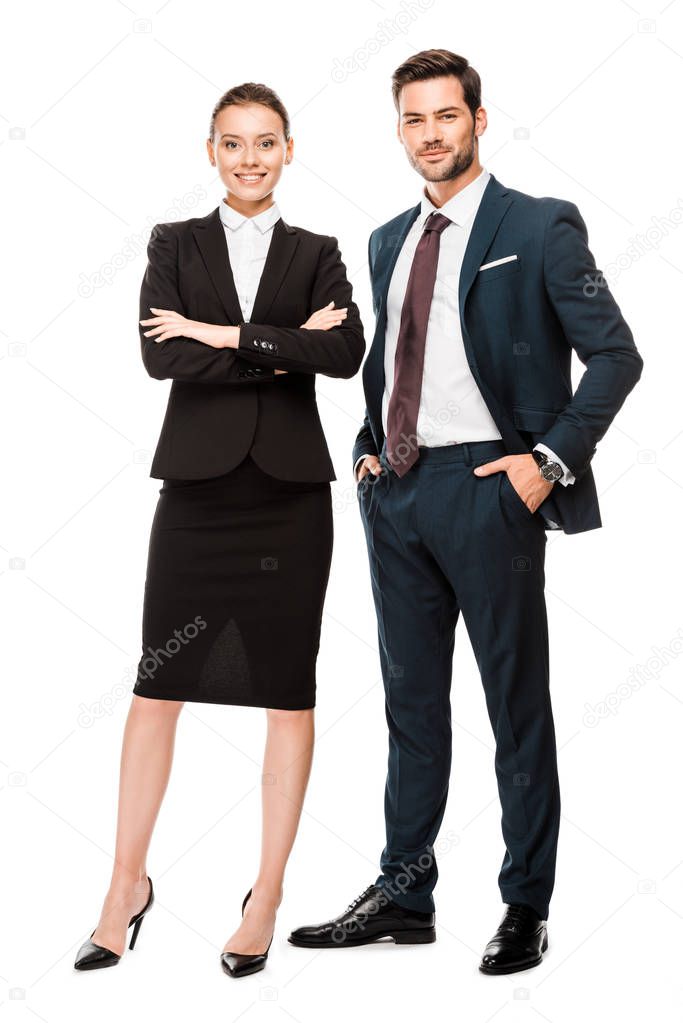 attractive young business partners in stylish suits looking at camera isolated on white