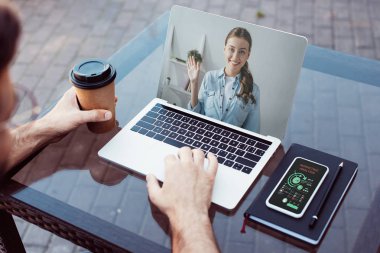 cropped image of man taking part in webinar with laptop clipart