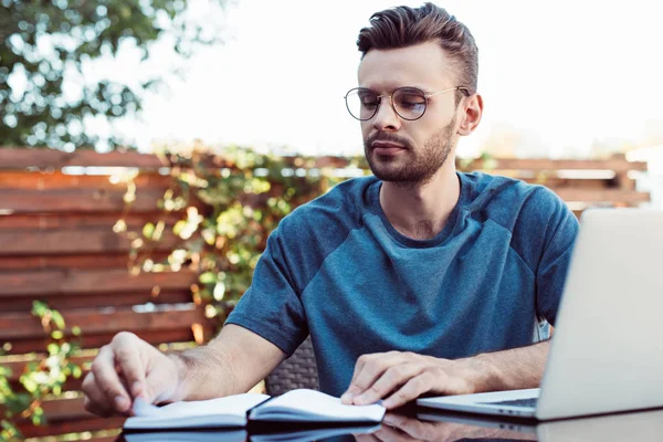 Pensive Handsome Man Glasses Taking Part Webinar Looking Notebook Park — Stock Photo, Image