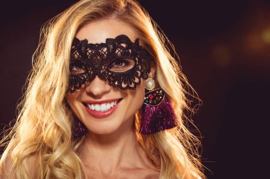 beautiful blonde smiling girl in black carnival mask clipart