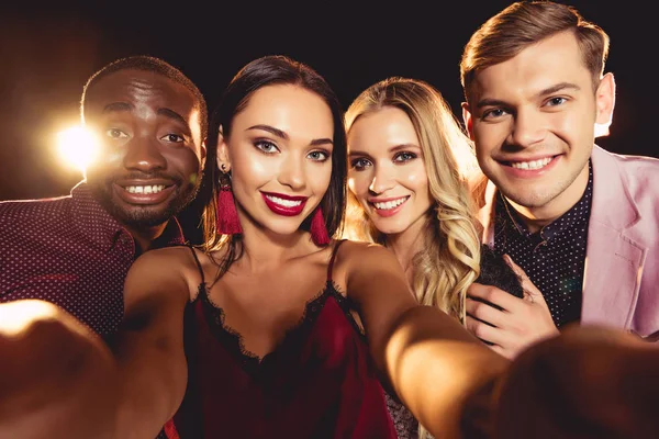 Cheerful Glamorous Multicultural Friends Taking Selfie Black Backlit — Stock Photo, Image