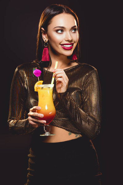 cheerful glamorous girl with alcohol cocktail on black