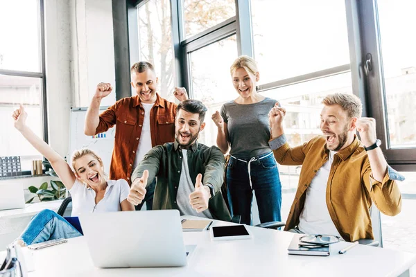 Group Young Successful Entrepreneurs Celebrating Victory Showing Thumbs Office Looking Stock Image