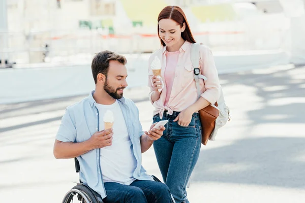 Handsome Boyfriend Wheelchair Girlfriend Ice Cream Using Smartphone Street — Stock Photo, Image