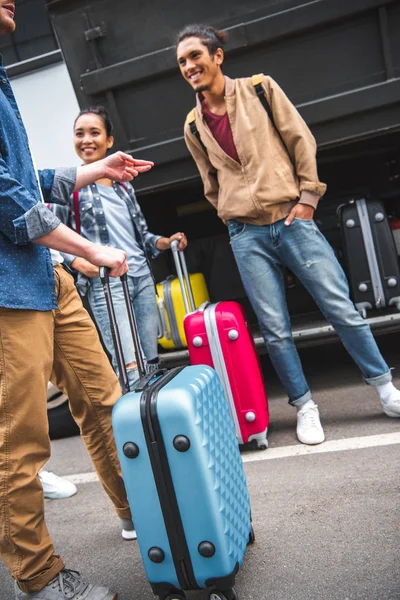 Cropped Image Man Wheeled Bag Gesturing Talking Multicultural Friends Bus — Stock Photo, Image