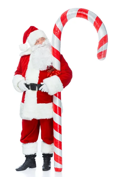 Santa Claus Standing Big Christmas Candy Cane Isolated White — Free Stock Photo
