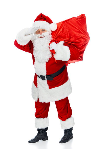 santa claus in red costume with christmas bag looking away isolated on white