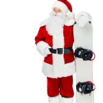 Confident Santa claus standing with snowboard isolated on white