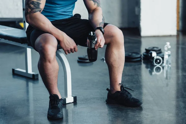 Cropped View Young Sportsman Sitting Gym — Free Stock Photo