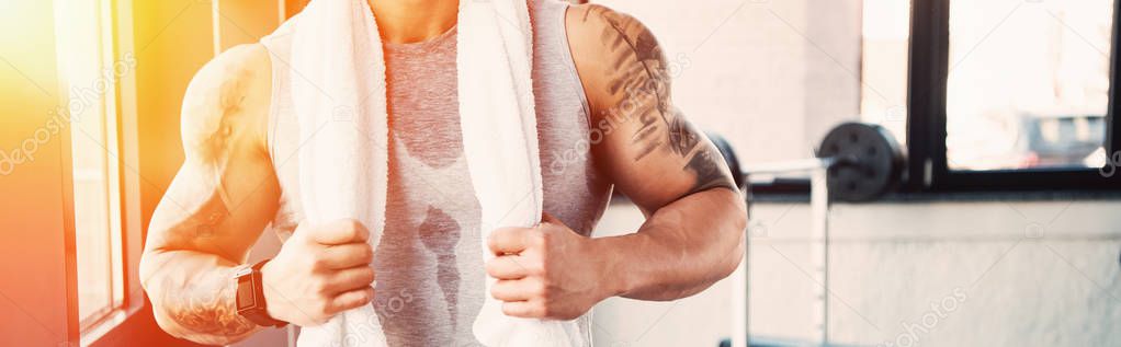 partial of young sportsman after long workout in sunlight