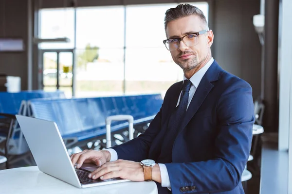 Handsome Businessman Glasses Looking Camera Using Laptop Airport — Stock Photo, Image