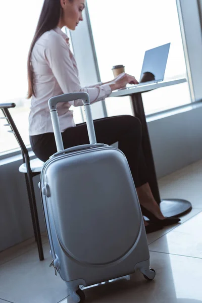 Grey Suitcase Young Businesswoman Typing Laptop Airport — Stock Photo, Image