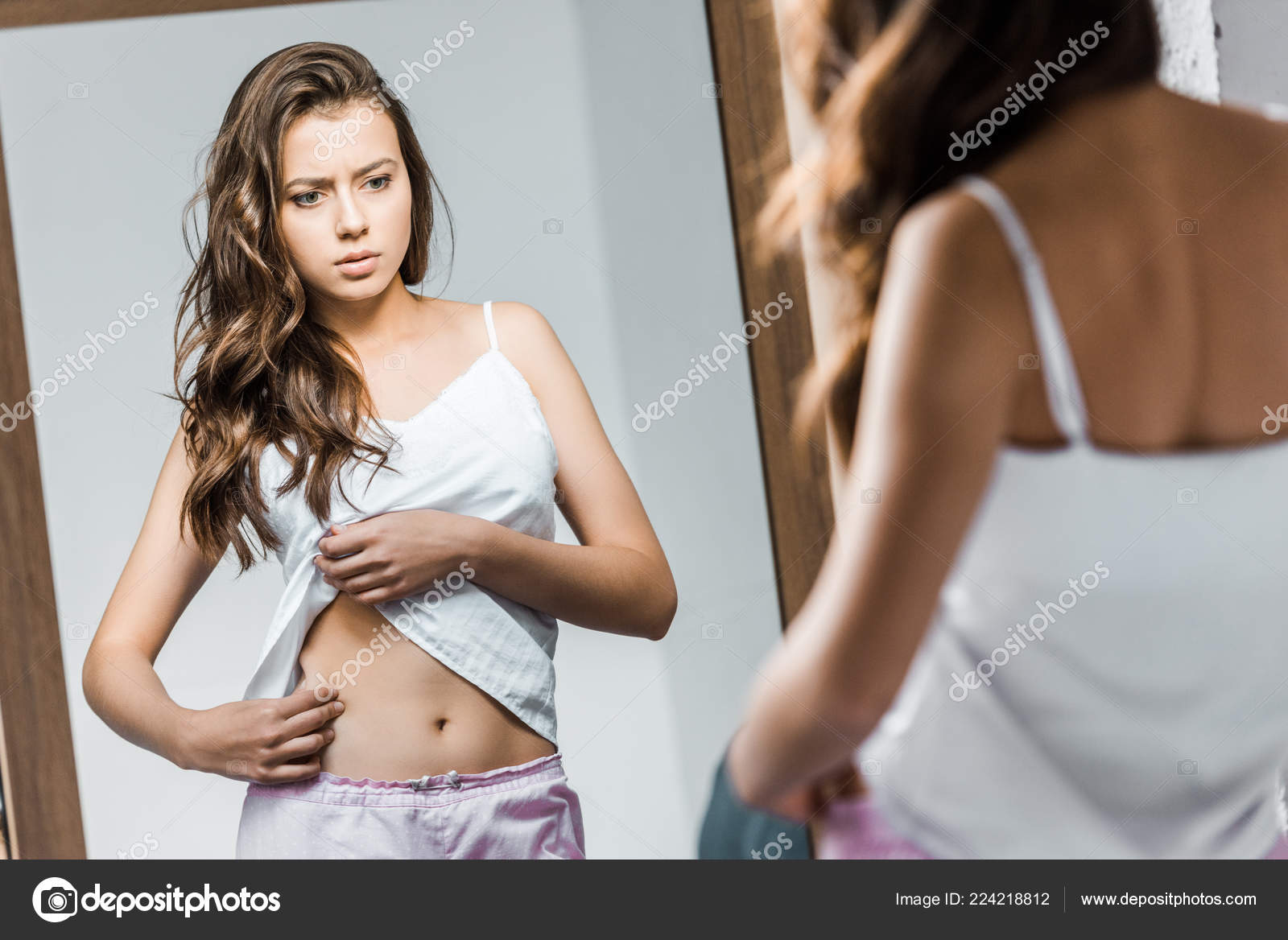 Upset Young Woman Looking Her Waistline Mirror — Stock Photo ©  AllaSerebrina #224218812, image size:1600x1168