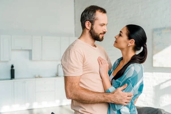 Portrait Smiling Couple Embracing Looking Each Other Home — Stock Photo, Image