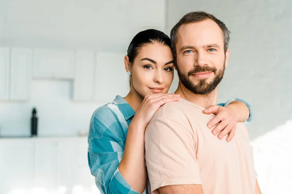 Portrait Happy Wife Embracing Husband Looking Camera — Stock Photo, Image