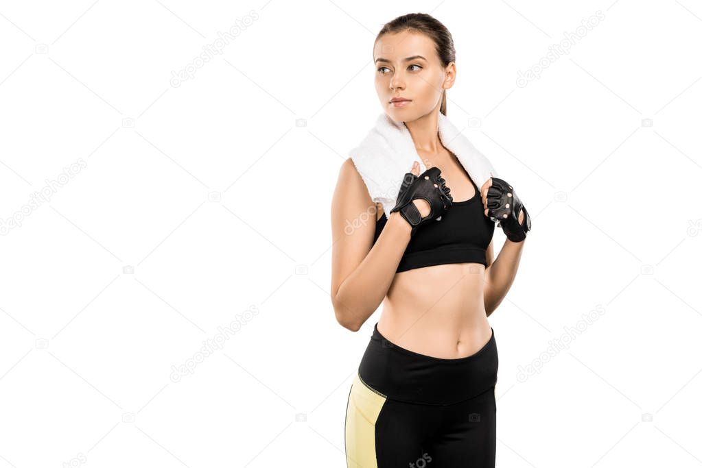 serious sportswoman in weightlifting gloves with white towel isolated on white