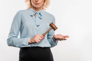 cropped shot of judge holding wooden hammer isolated on white    clipart