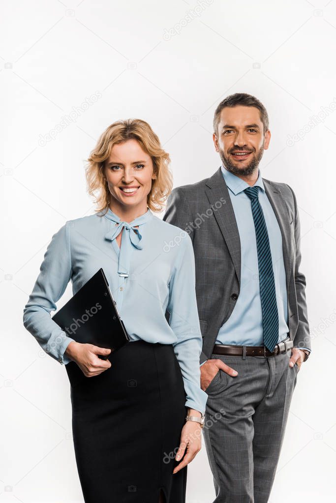 businessman and businesswoman in formal wear standing together and smiling at camera isolated on white  