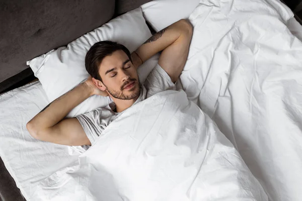 Top View Handsome Bearded Young Man Sleeping Hands Head Bed — Stock Photo, Image