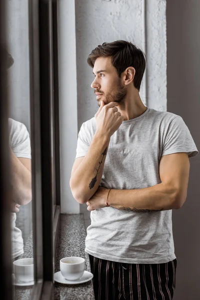 Handsome Pensive Young Man Pajamas Looking Window Morning — Stock Photo, Image