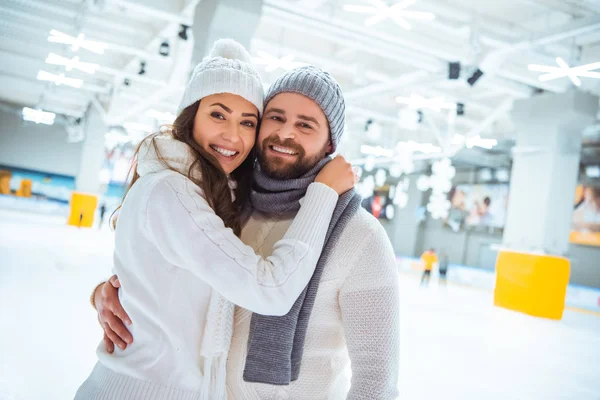 Portrait Happy Couple Hugging Looking Camera Skating Rink — Stock Photo, Image