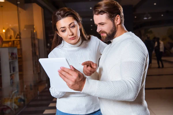Couple White Knitted Sweaters Using Digital Tablet Together — Free Stock Photo