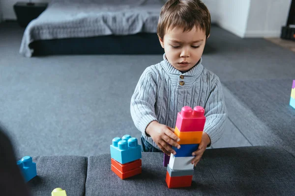 Focused Little Boy Playing Colorful Plastic Blocks Home — Stock Photo, Image