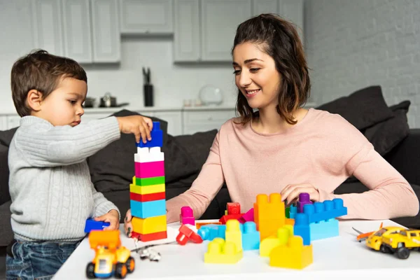 Selective Focus Mother Little Son Playing Colorful Plastic Blocks Home — Stock Photo, Image