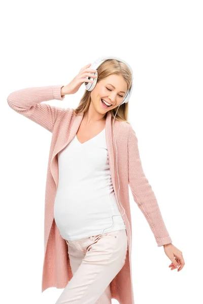 Lachende Zwangere Vrouw Zingen Met Koptelefoon Wit Wordt Geïsoleerd — Gratis stockfoto