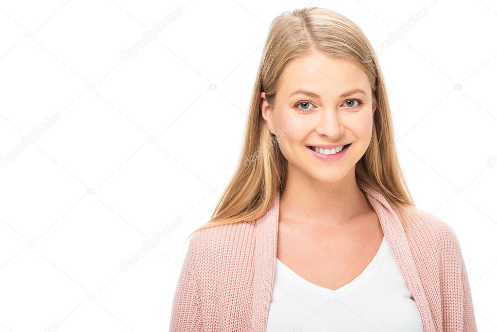 beautiful woman in pink cardigan smiling and looking at camera isolated on white