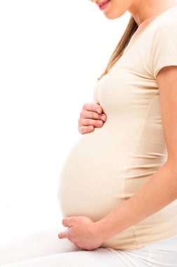 cropped view of pregnant woman keeping hands on belly isolated on white clipart