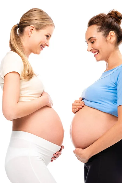 Two Pregnant Women Holding Hands Bellies Smiling Each Other Isolated — Stock Photo, Image