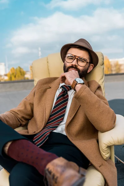 Handsome Bearded Businessman Sitting Armchair Roof — Free Stock Photo