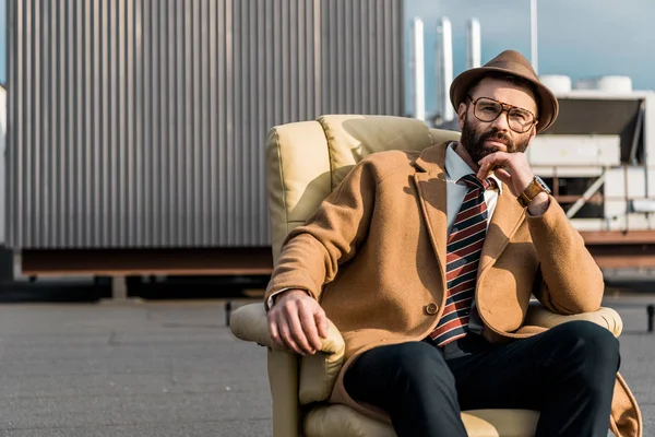 Adult Businessman Hat Glasses Sitting Armchair Roof — Free Stock Photo