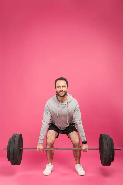 Красивый Спортсмен Поднимает Штангу Изолированную Розовый — Бесплатное стоковое фото