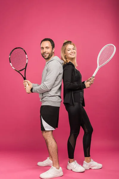 Tennis Players Holding Rackets Together Isolated Pink — Stock Photo, Image